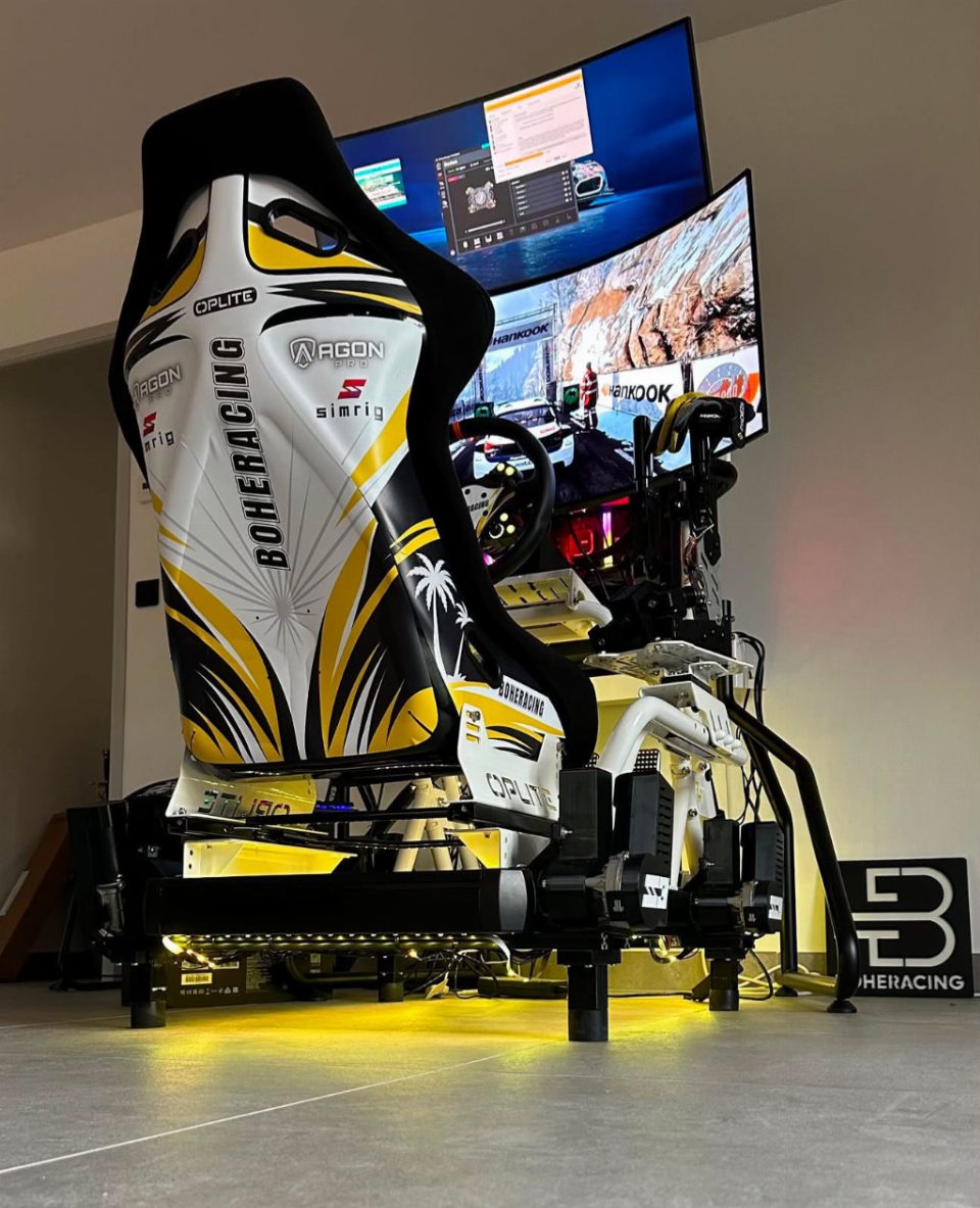 A SIMRIG SR3 motion system under a sim racing rig with two curved screens