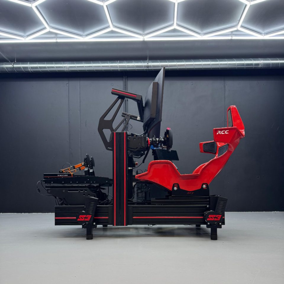 A SIMRIG SR3 motion system under a sim racing rig with a red racing seat